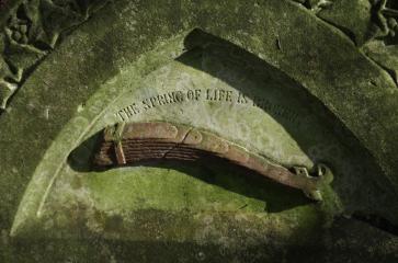 A unique symbol in Nunhead Cemetery - a carriage spring. copyright Carole Tyrrell