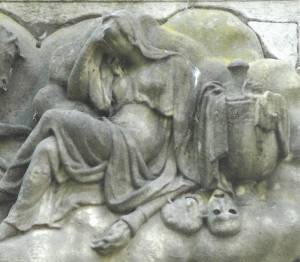 Relief on Durcow monument depicting weeping woman in Grecian dress with Comedy and Tragedy beside her. http://www.victorianweb.org/art/parks/kensalgreen/13.html ©Robert Friedus 2012